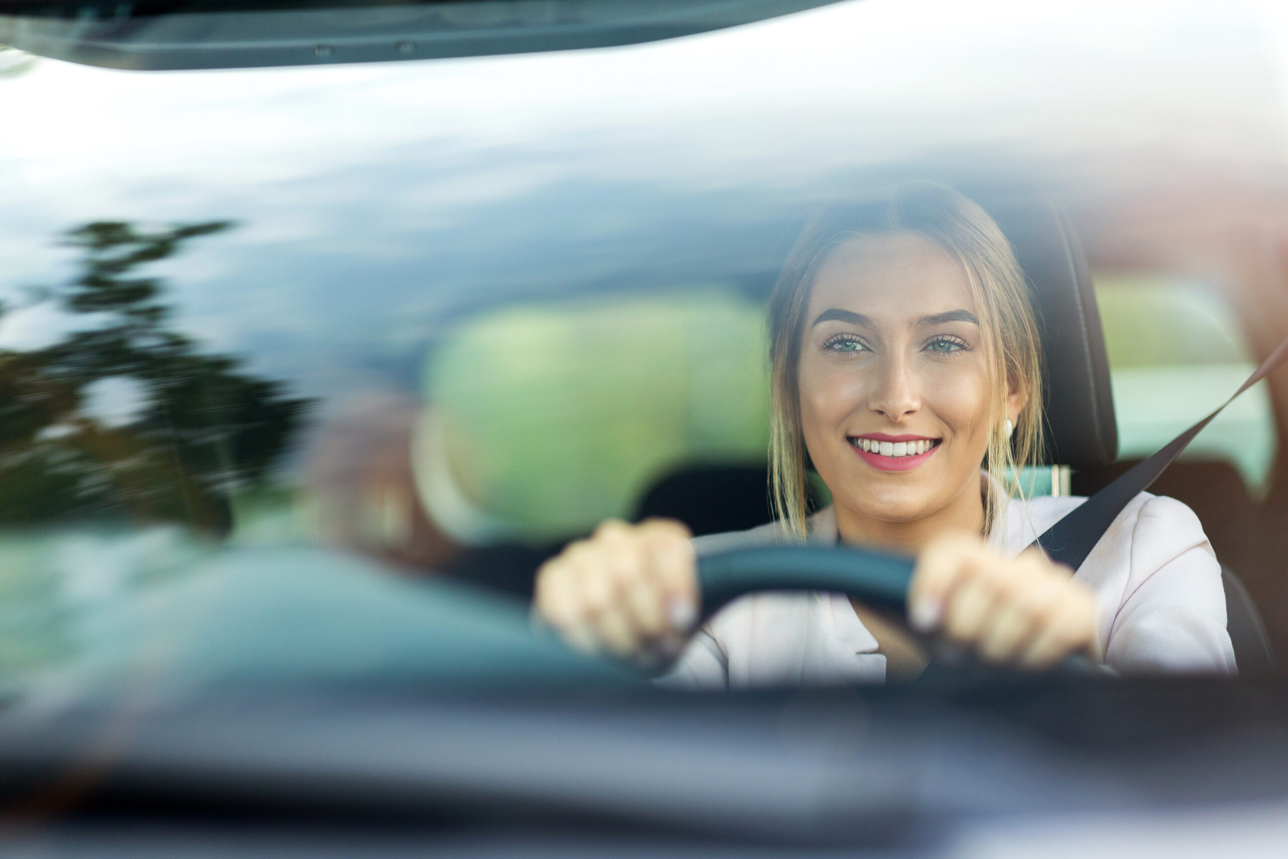 Young woman sitting in a car